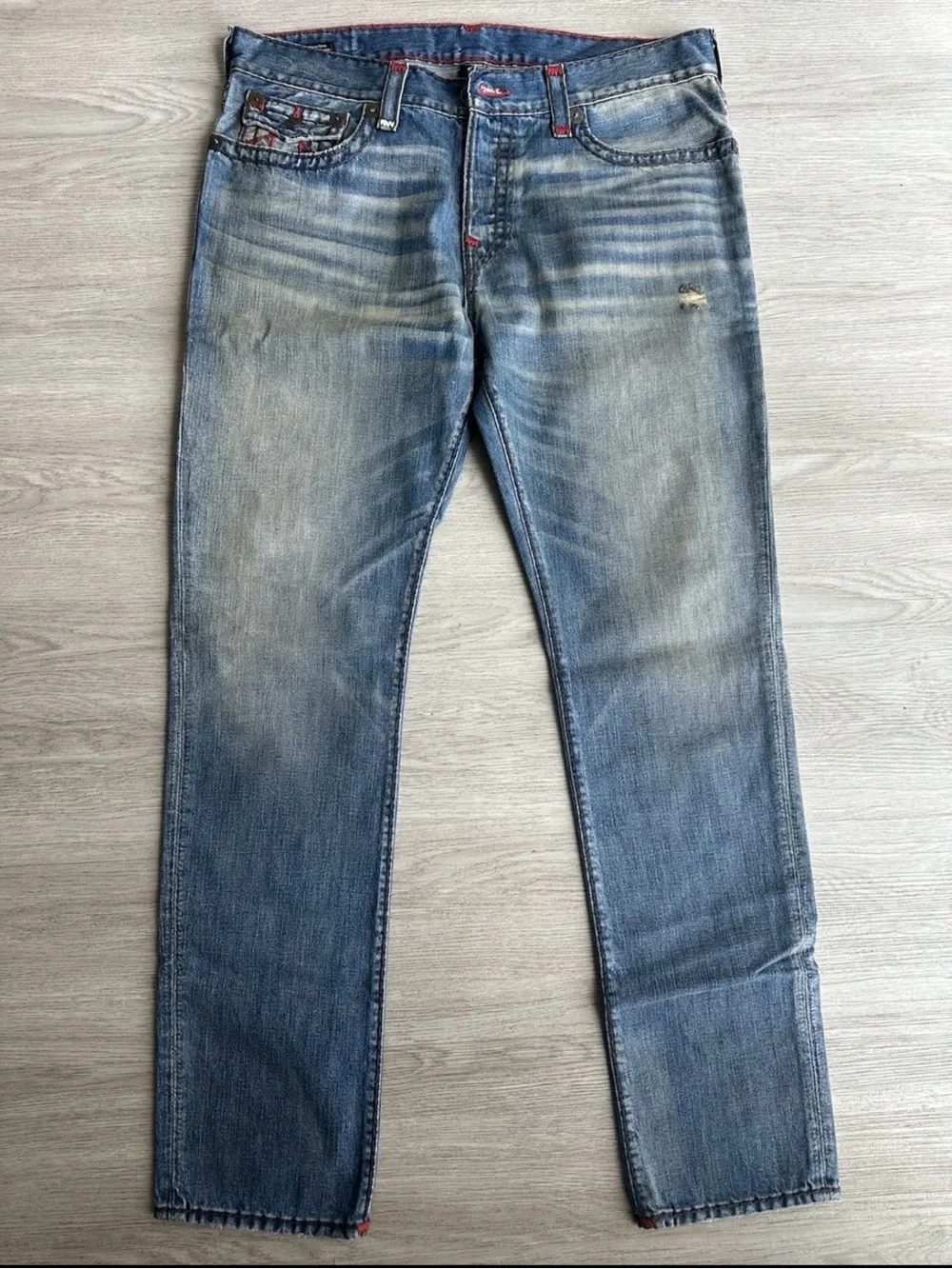 True Religion Faded Blue Slim Straight Jeans with Subtle Whiskering